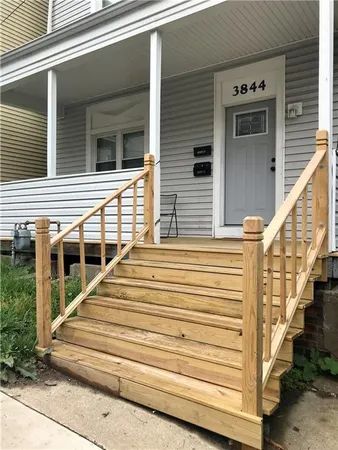 a view of a house with more windows and stairs