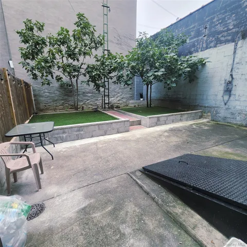 a view of yard with patio