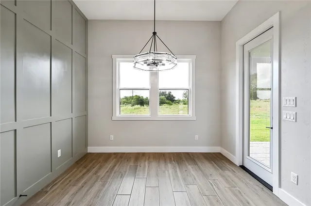 a spacious bathroom with a shower tub double vanity and a mirror