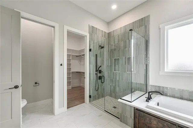 an empty room with wooden floor and a window