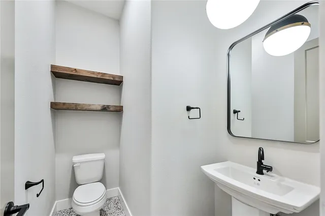 a kitchen with sink and cabinets