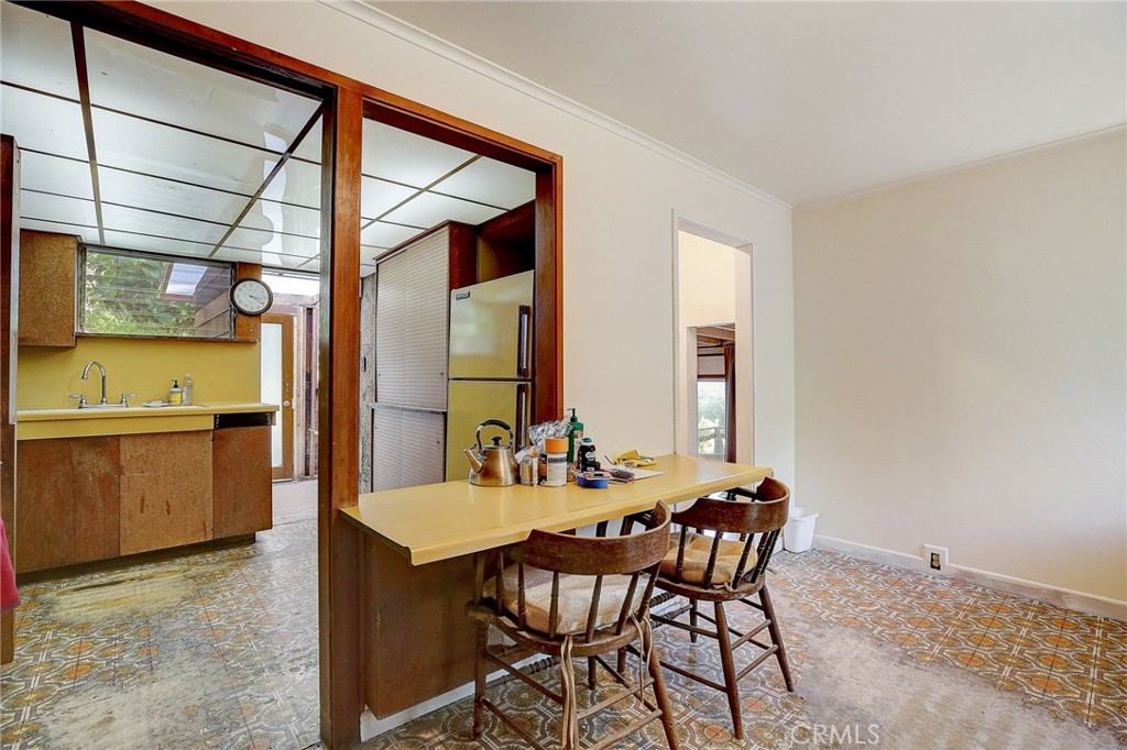 755 Crane Boulevard Los Angeles, CA 90065 - Photo 12 of 40 a dining room with furniture and wooden floor