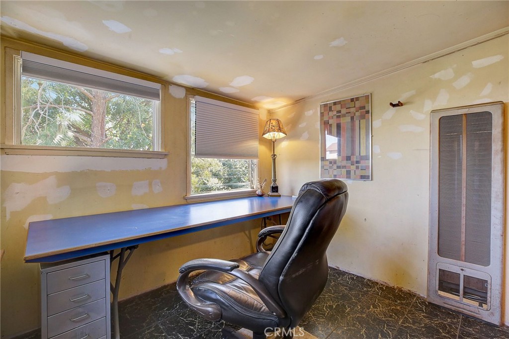 755 Crane Boulevard Los Angeles, CA 90065 - Photo 18 of 40 a blue chair sitting in a room next to a window