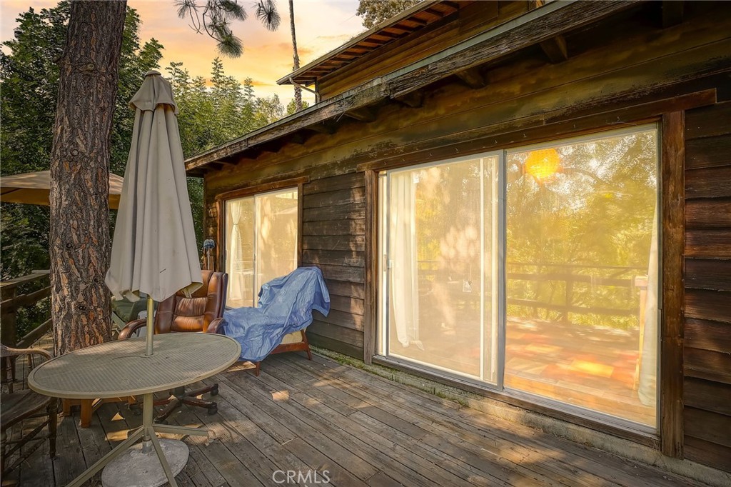 755 Crane Boulevard Los Angeles, CA 90065 - Photo 2 of 40 a balcony with furniture and wooden floor