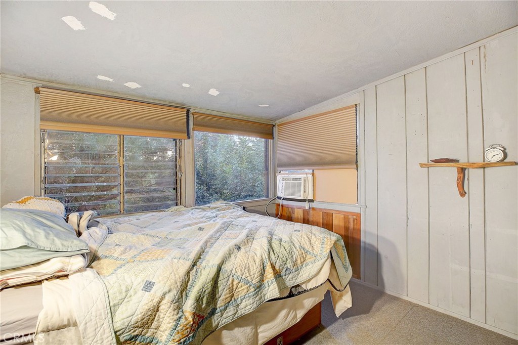 755 Crane Boulevard Los Angeles, CA 90065 - Photo 21 of 40 a bed sitting in a spacious bedroom next to a window