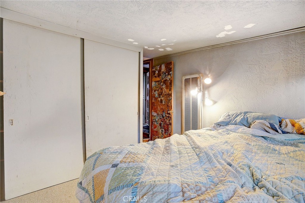 755 Crane Boulevard Los Angeles, CA 90065 - Photo 22 of 40 a large bedroom with bed and window