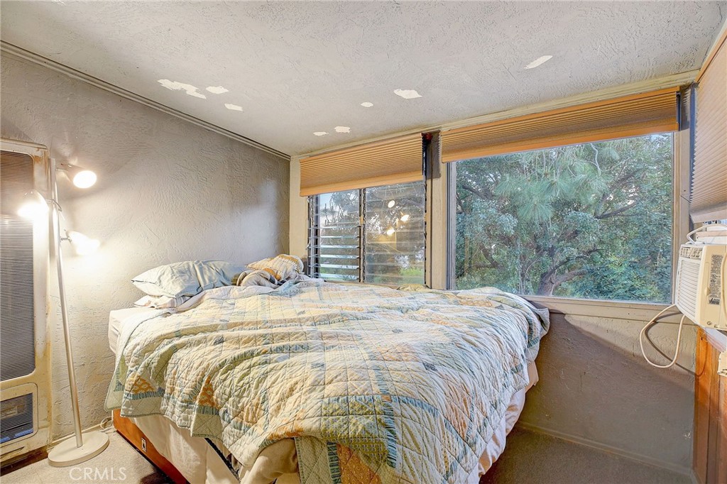 755 Crane Boulevard Los Angeles, CA 90065 - Photo 23 of 40 a bed sitting in a spacious bedroom next to a window