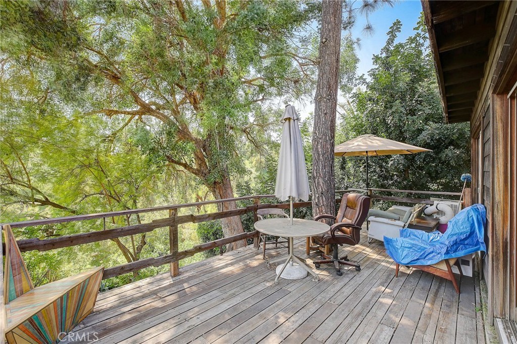 755 Crane Boulevard Los Angeles, CA 90065 - Photo 24 of 40 a view of a balcony with chairs and wooden floor