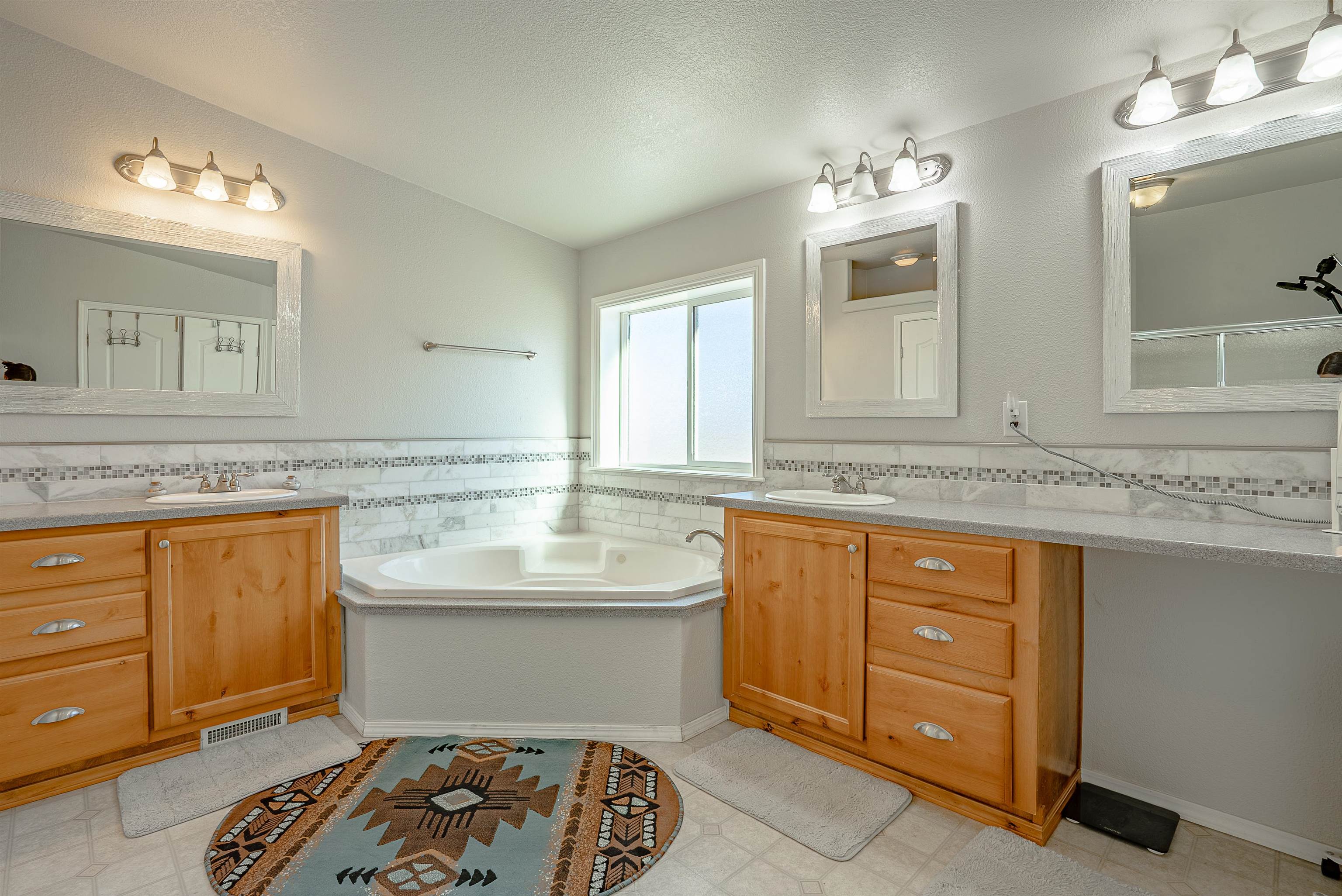714-100 Sears Road Janesville, CA 96114 - Photo 29 of 35 a spacious bathroom with a granite countertop double vanity sink mirror and