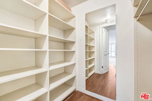 a view of a room with wooden floor and closet
