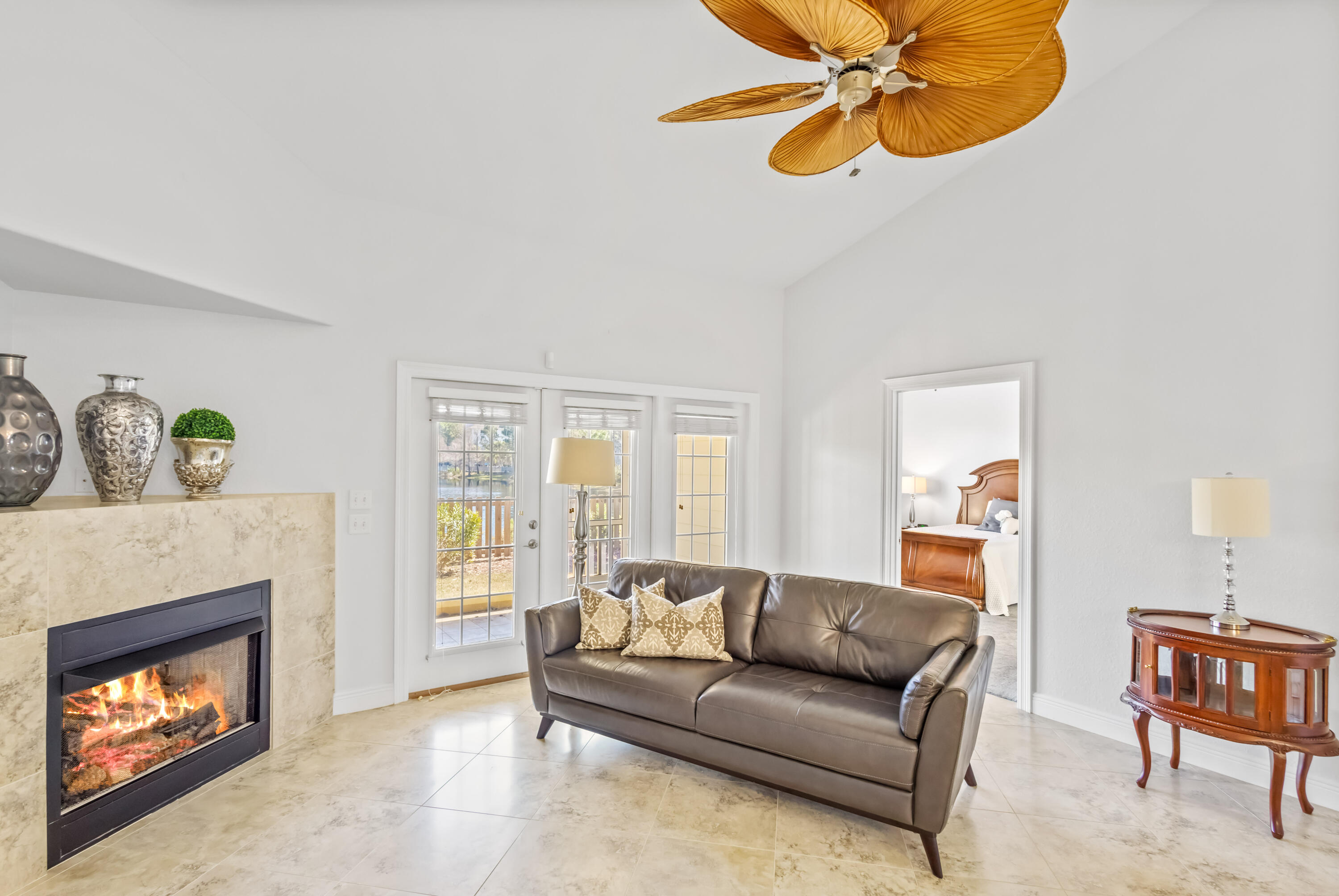 4248 Jade Loop Destin, FL 32541 - Photo 15 of 46 a living room with furniture a window and a fireplace
