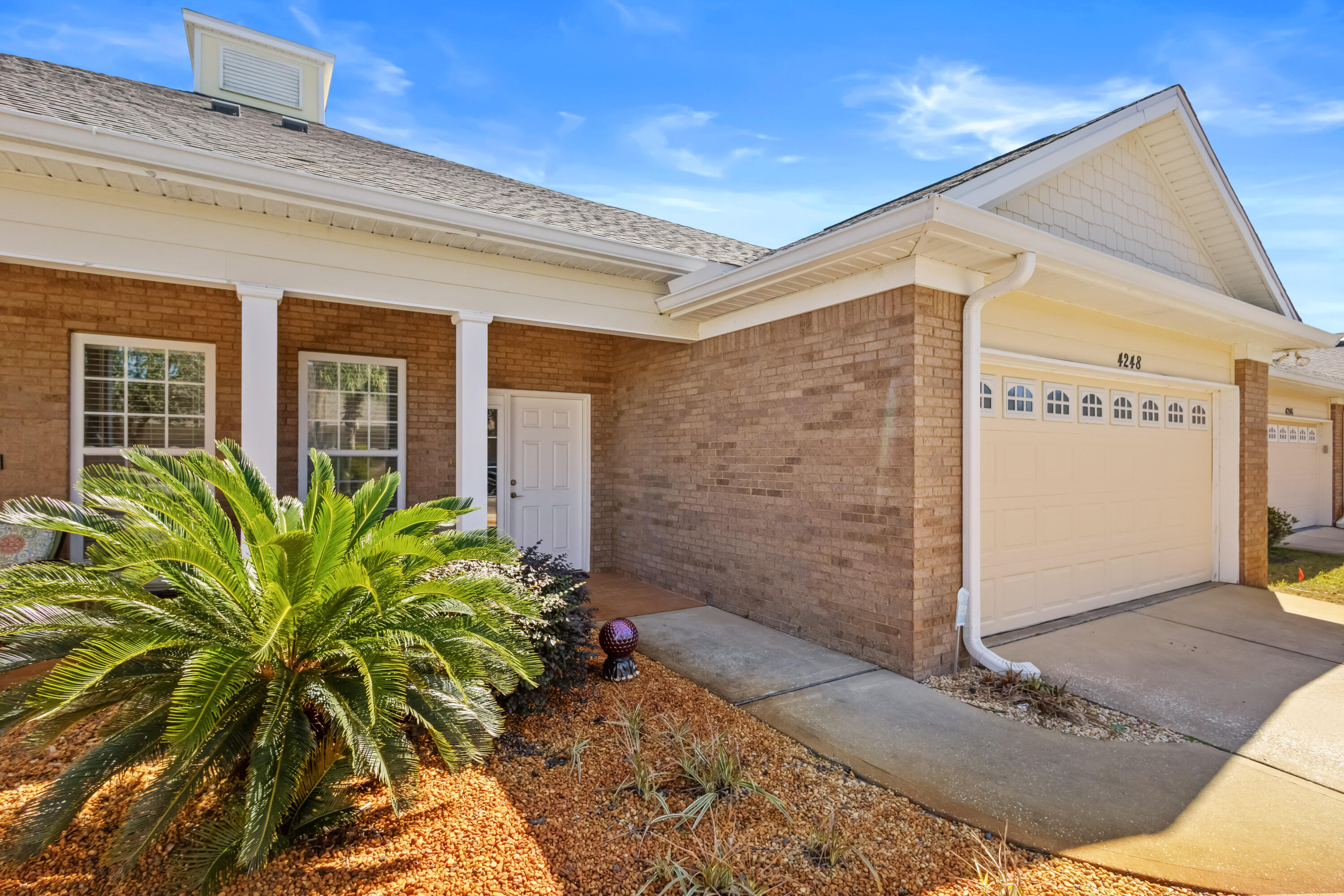 4248 Jade Loop Destin, FL 32541 - Photo 2 of 46 a view of a potted plants in front of a building