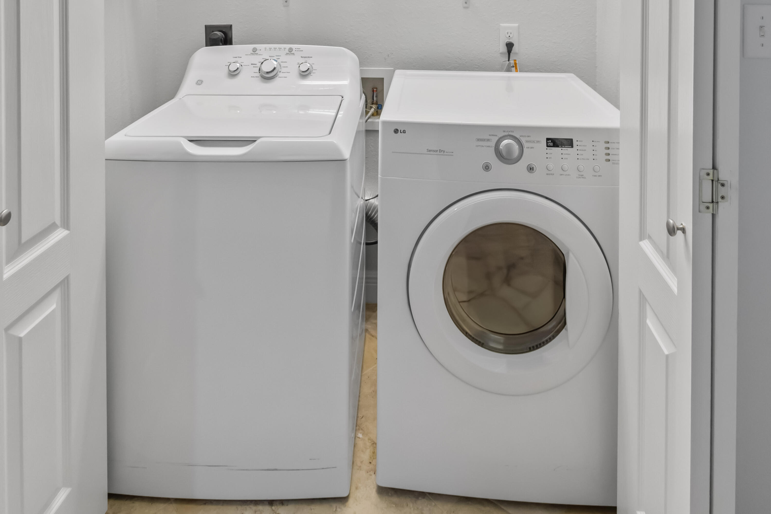 4248 Jade Loop Destin, FL 32541 - Photo 31 of 46 a utility room with dryer and washer