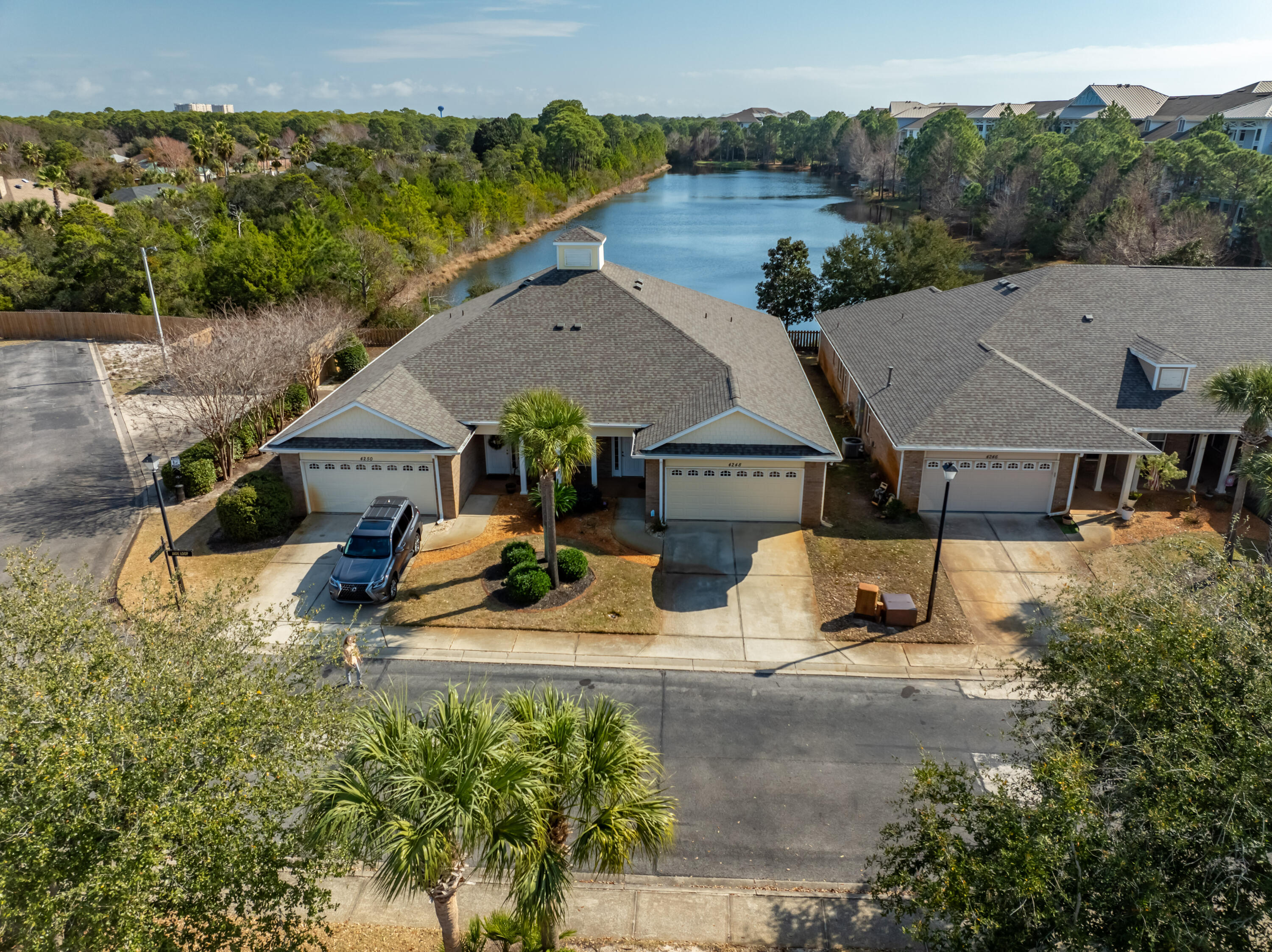 4248 Jade Loop Destin, FL 32541 - Photo 40 of 46 an aerial view of a house with swimming pool and ocean view