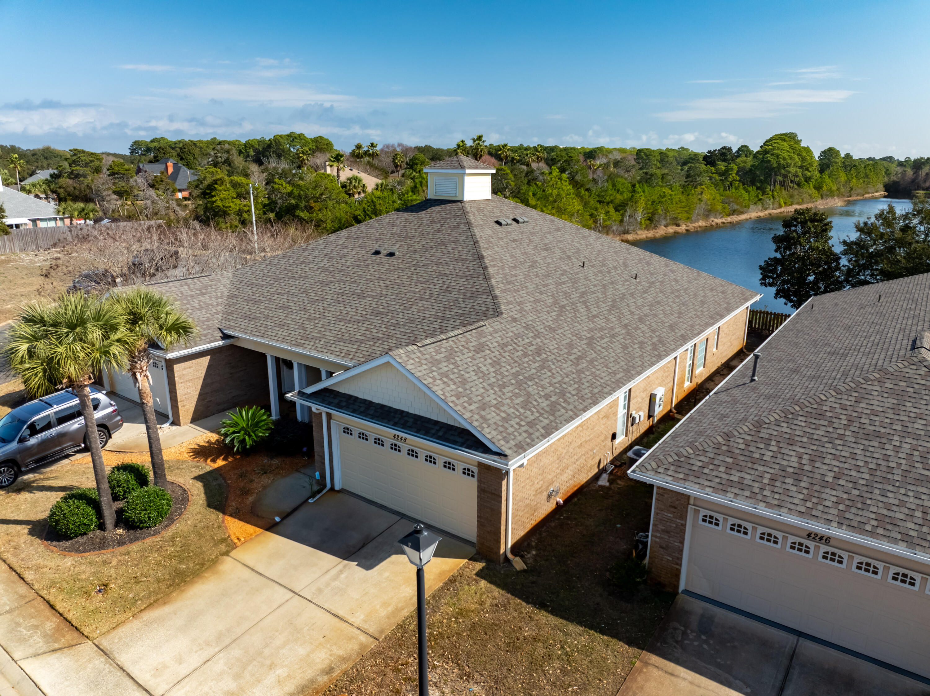 4248 Jade Loop Destin, FL 32541 - Photo 42 of 46 an aerial view of a house having yard