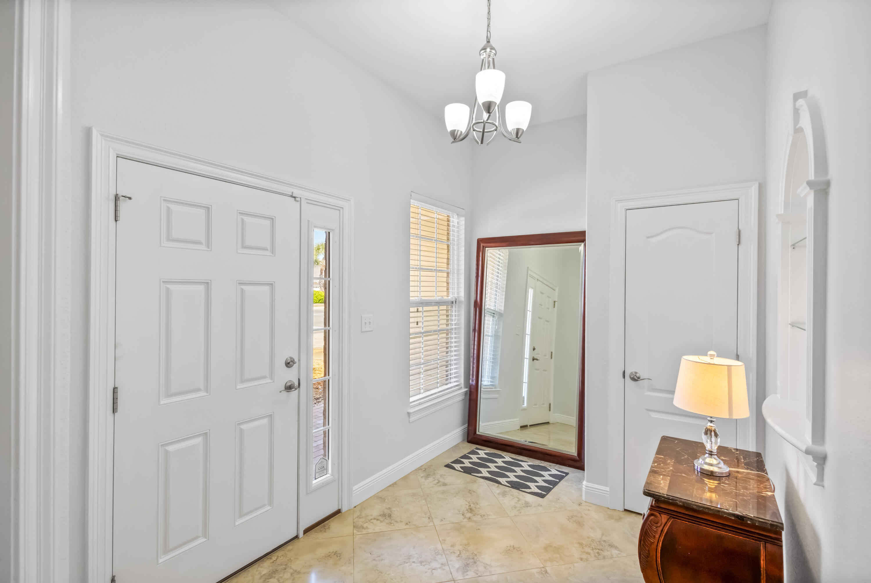 4248 Jade Loop Destin, FL 32541 - Photo 5 of 46 a view of a bedroom from a hallway