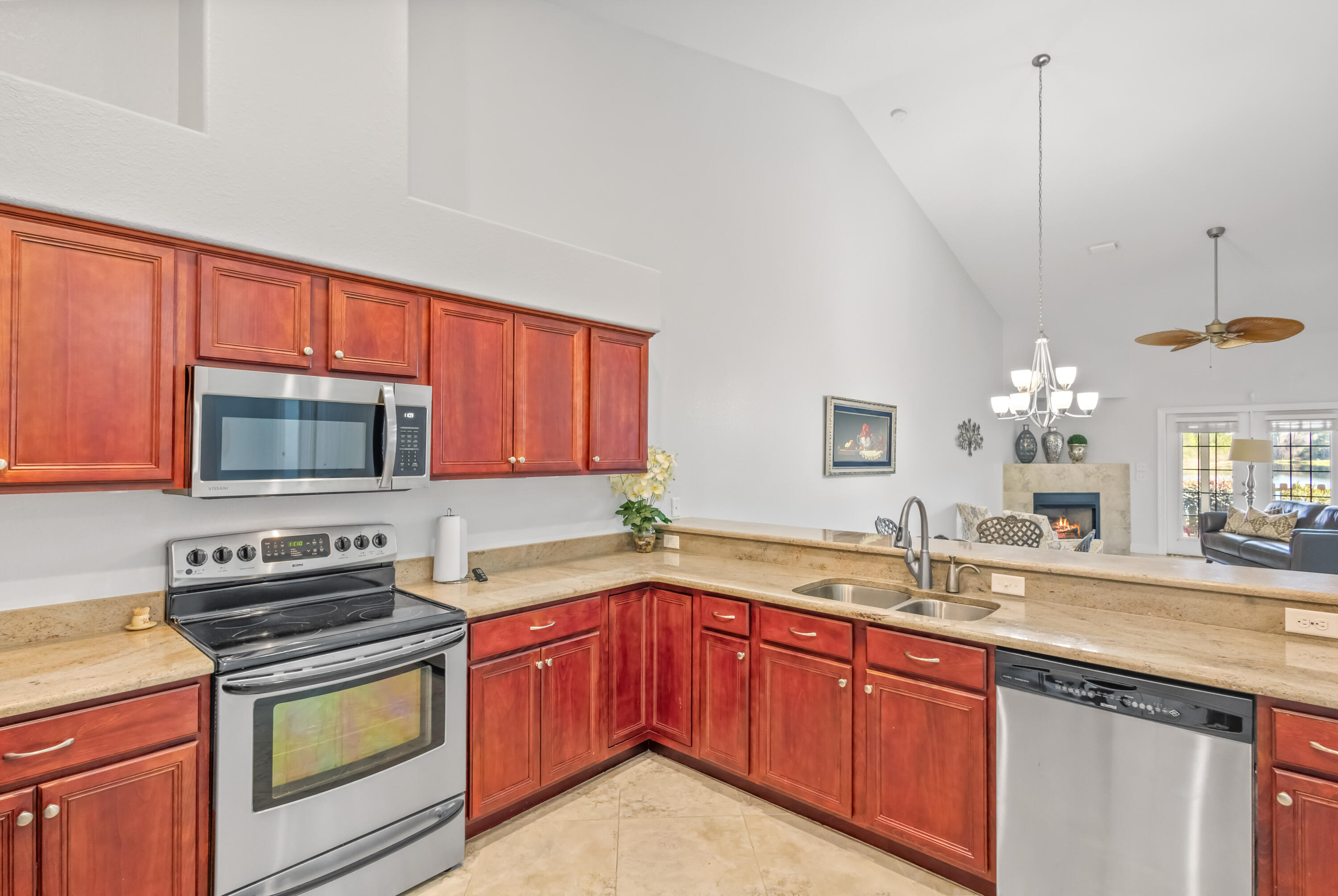 4248 Jade Loop Destin, FL 32541 - Photo 10 of 46 a kitchen with a sink stove and microwave