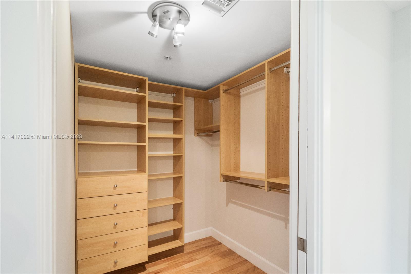3540 Main Highway, Unit 309 Miami, FL 33133 - Photo 15 of 34 a view of walk in closet with empty racks