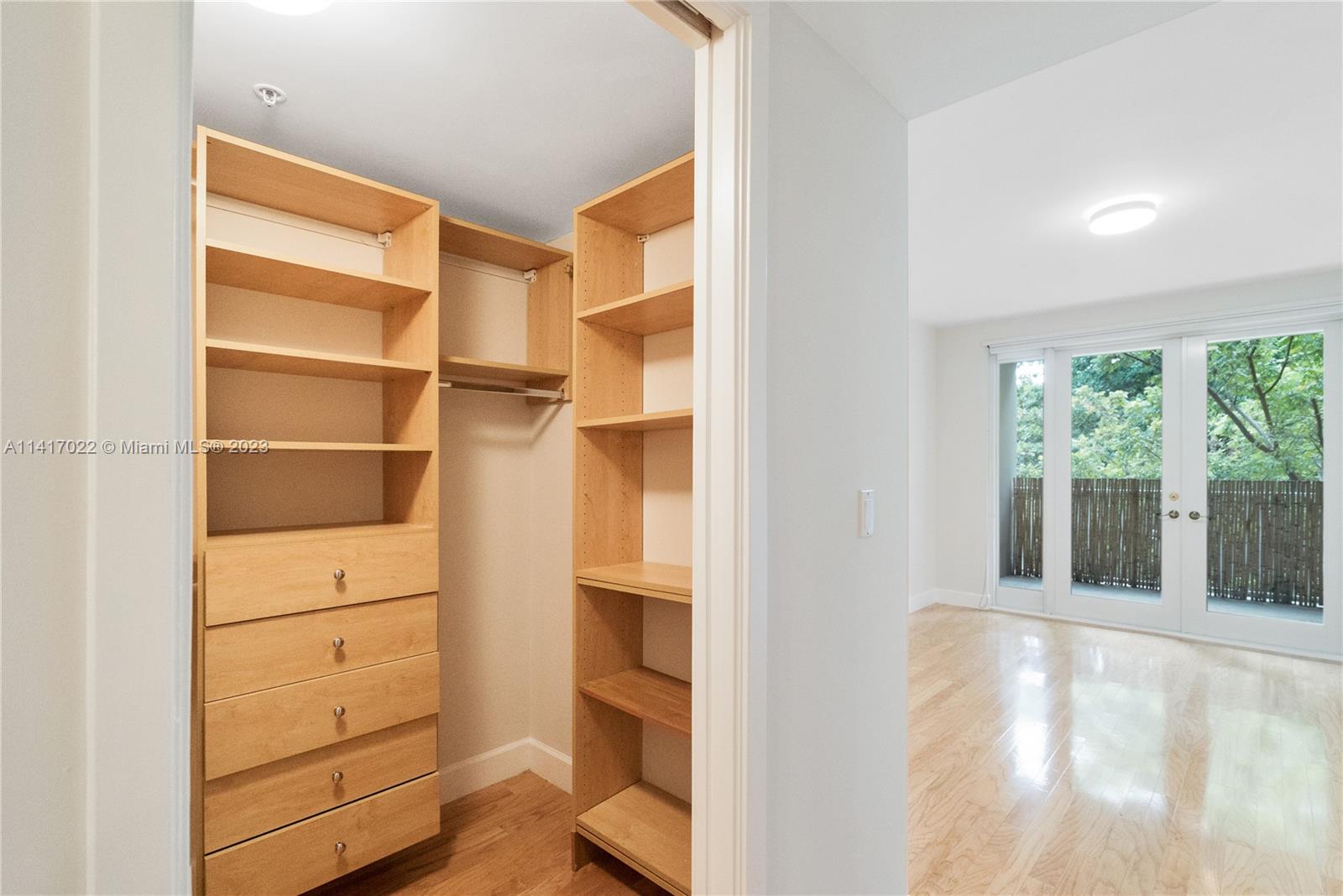 3540 Main Highway, Unit 309 Miami, FL 33133 - Photo 22 of 34 a view of walk in closet with empty racks