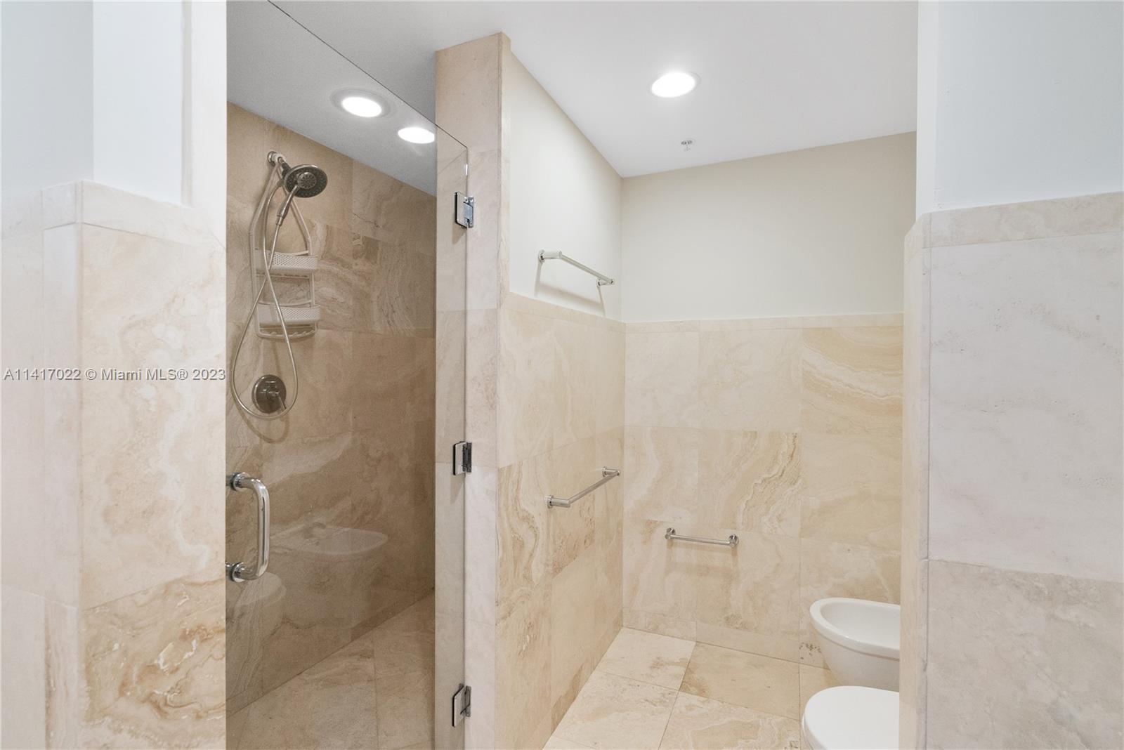 3540 Main Highway, Unit 309 Miami, FL 33133 - Photo 24 of 34 a bathroom with a shower and a toilet