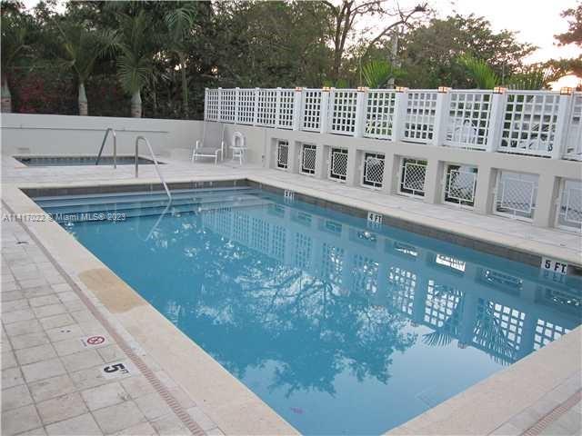 3540 Main Highway, Unit 309 Miami, FL 33133 - Photo 29 of 34 a view of a patio with a yard
