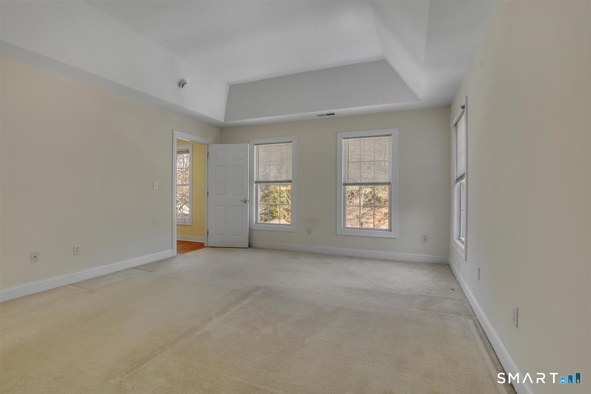 25 Fenwick Drive Avon, CT 06001 - Photo 21 of 40 an empty room with windows