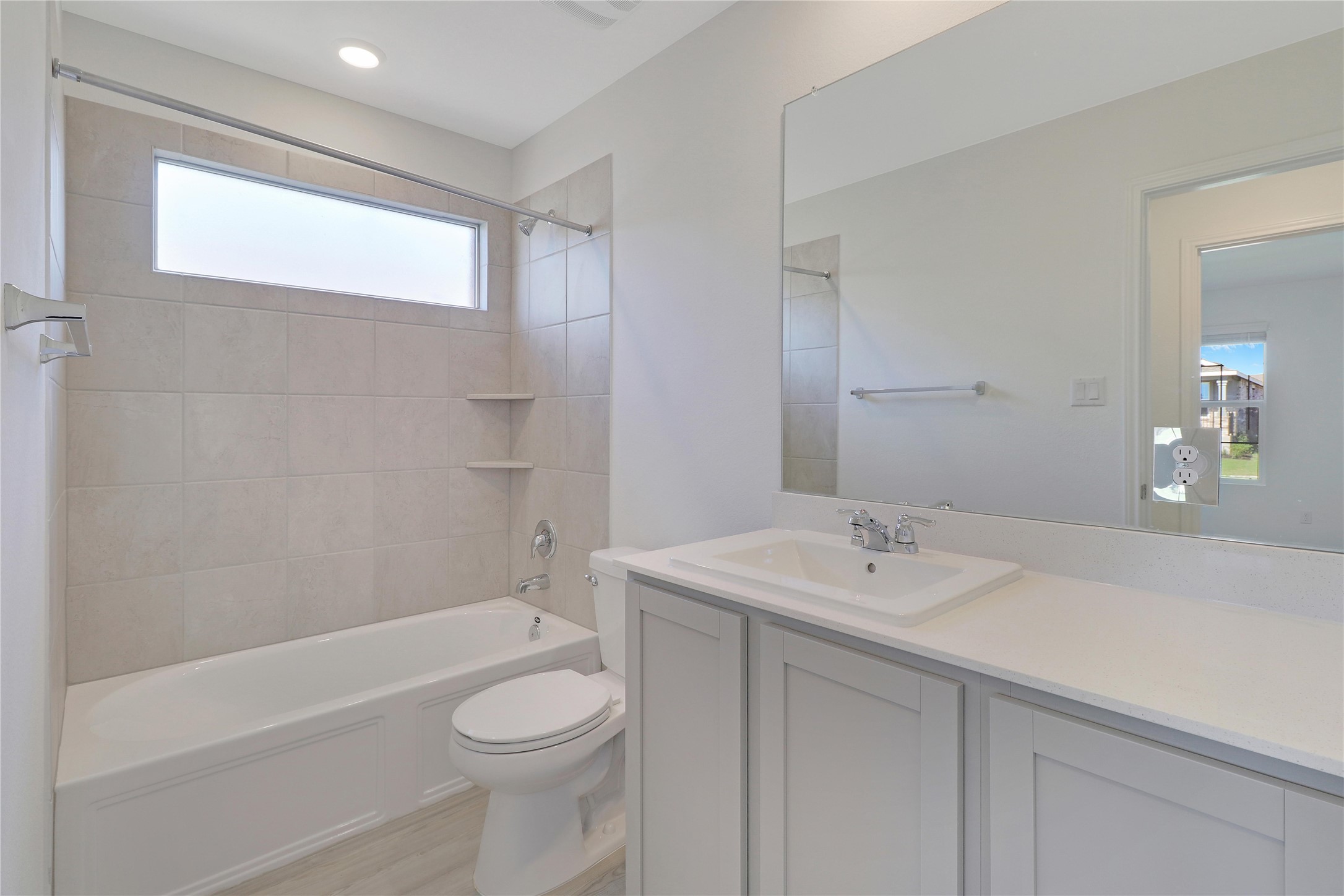 2524 Four Waters Loop Georgetown, TX 78628 - Photo 24 of 36 a bathroom with a sink a toilet and shower