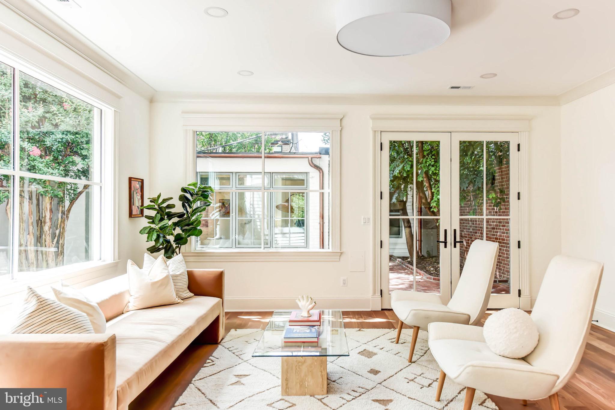311 5th Street Southeast Washington, DC 20003 - Photo 11 of 21 a living room with furniture and a large window