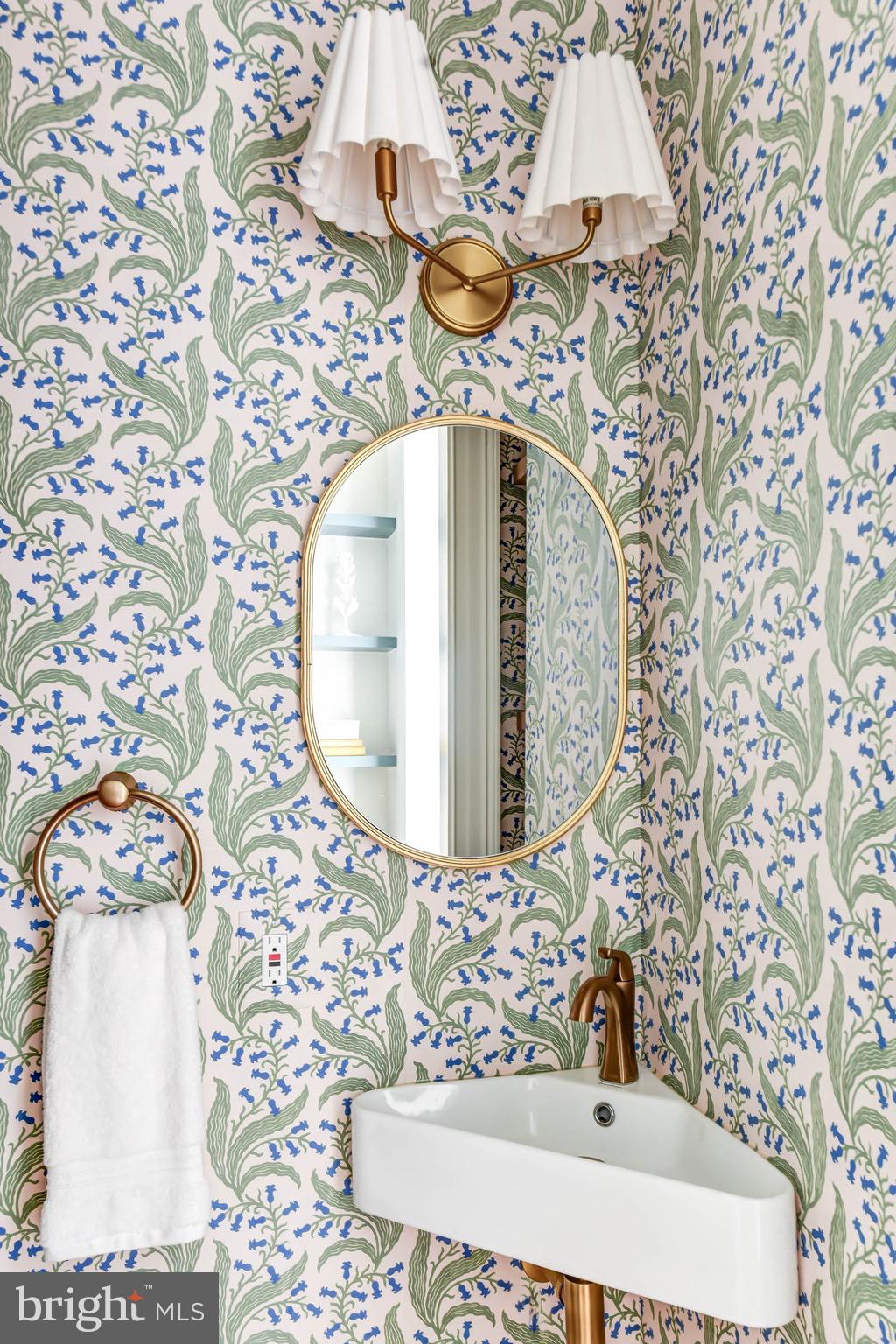 311 5th Street Southeast Washington, DC 20003 - Photo 13 of 21 a bathroom with a sink and mirror