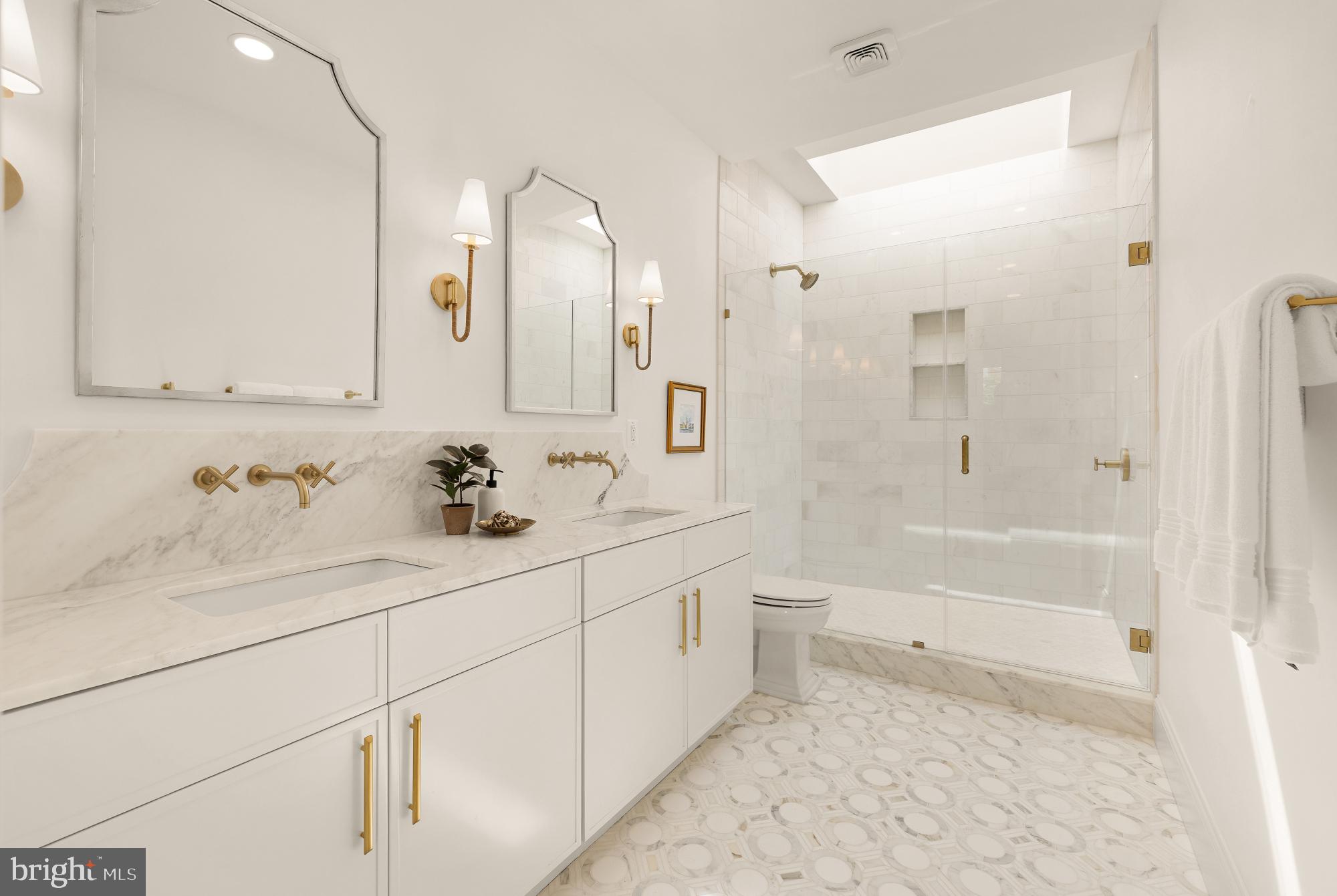 311 5th Street Southeast Washington, DC 20003 - Photo 15 of 21 a bathroom with a sink a toilet and shower