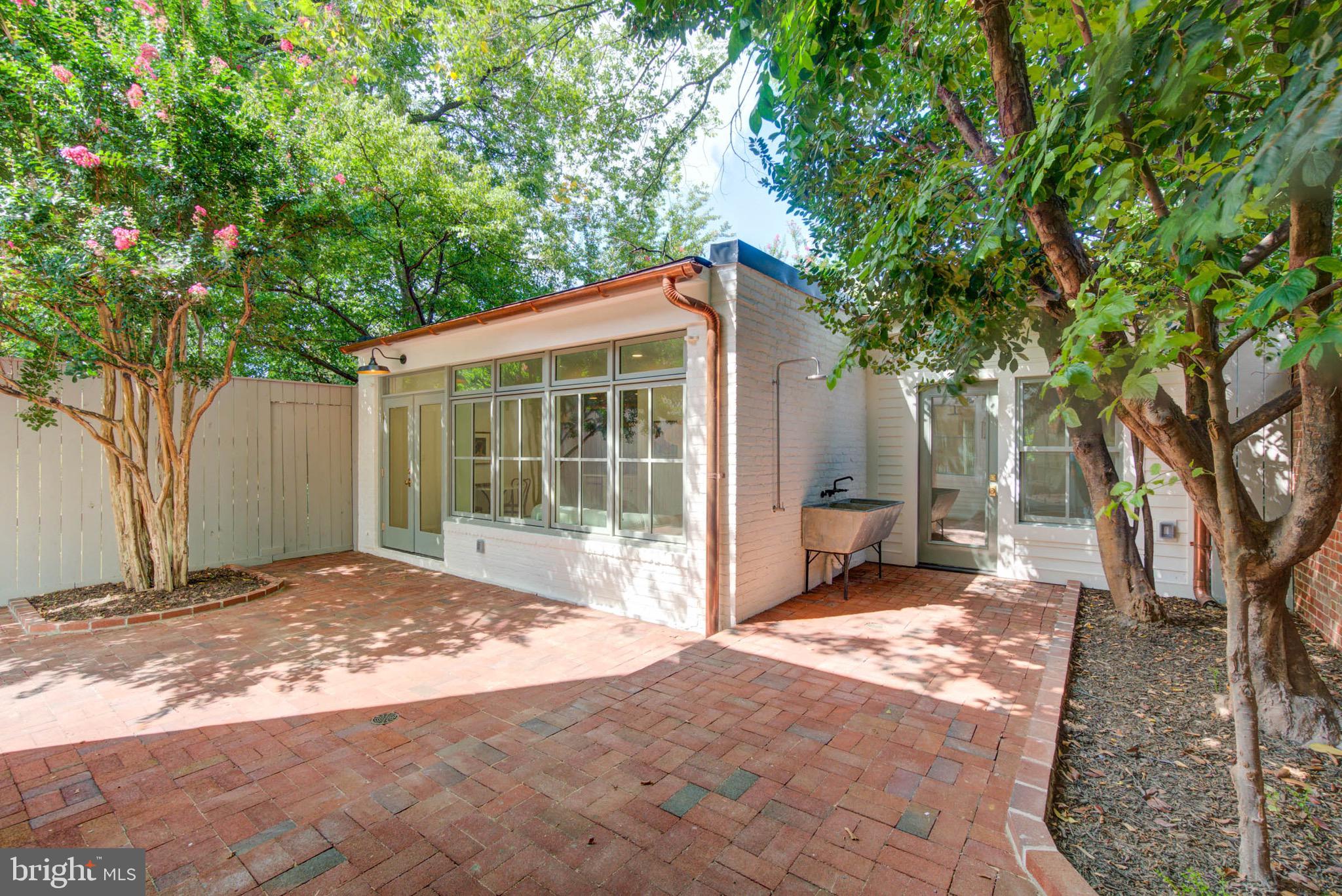 311 5th Street Southeast Washington, DC 20003 - Photo 3 of 21 a front view of a house with a garden