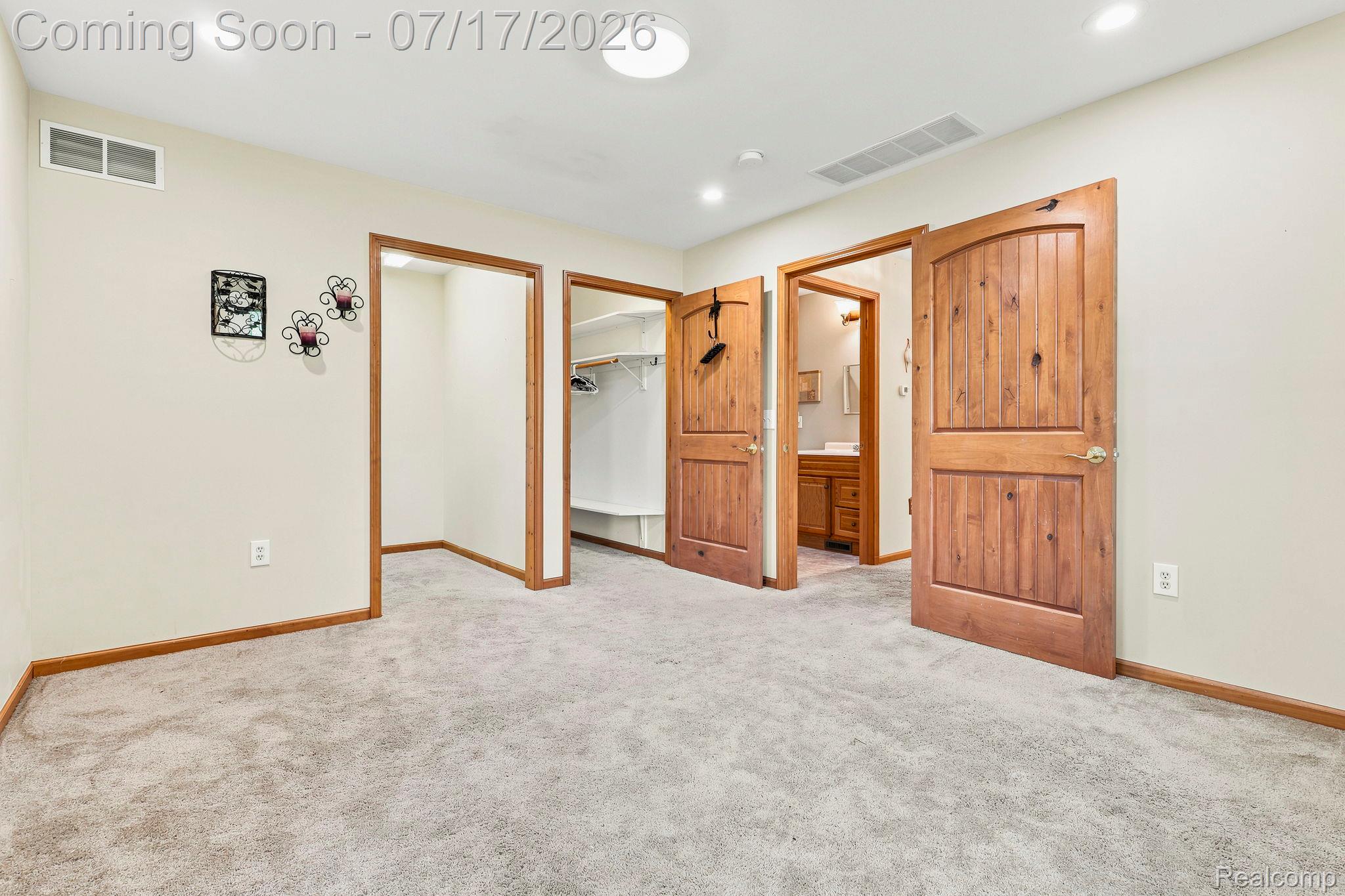 9805 Dolan Road Columbus, MI 48063 - Photo 25 of 39 Carpeted room with recessed lighting and crown molding
