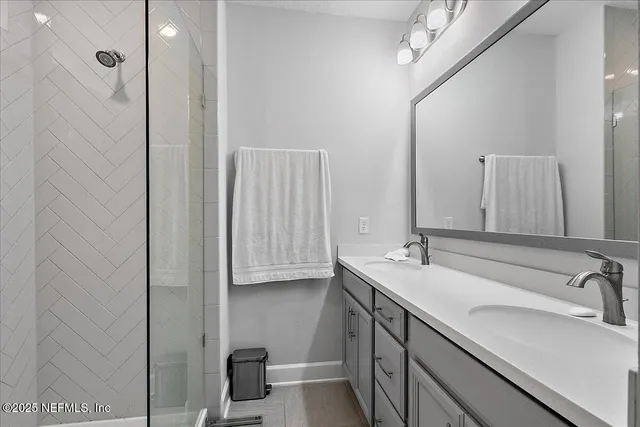 a bathroom with a sink and mirror