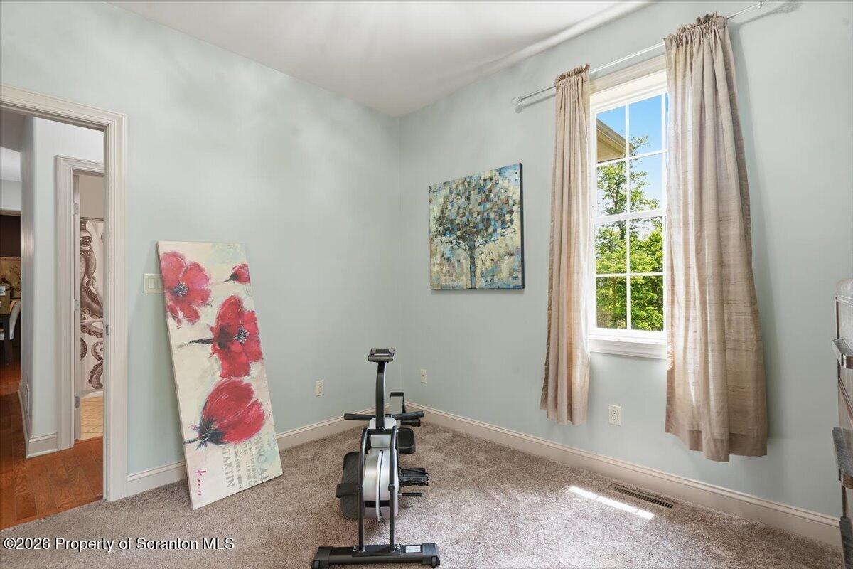 99 Hilltop Road Waverly, PA 18471 - Photo 25 of 41 a view of a room with gym equipment