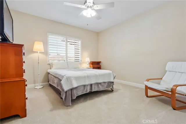 a bedroom with a bed furniture and a window