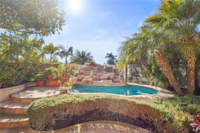 a view of a water fountain in front of the house