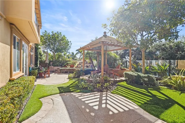a view of a backyard with sitting area