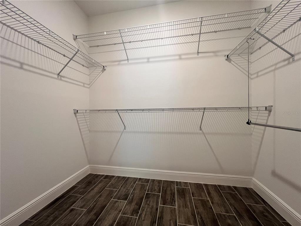 301 Jackson Loop DeLand, FL 32724 - Photo 11 of 22 a view of a room with racks on the wall