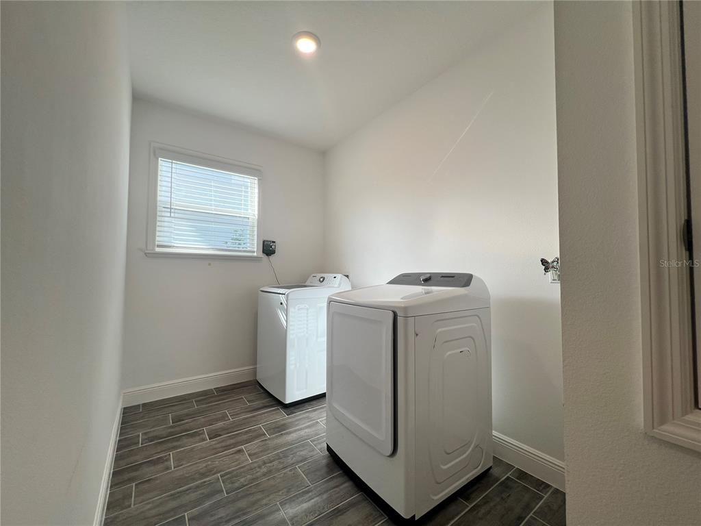 301 Jackson Loop DeLand, FL 32724 - Photo 16 of 22 a utility room with dryer and washer