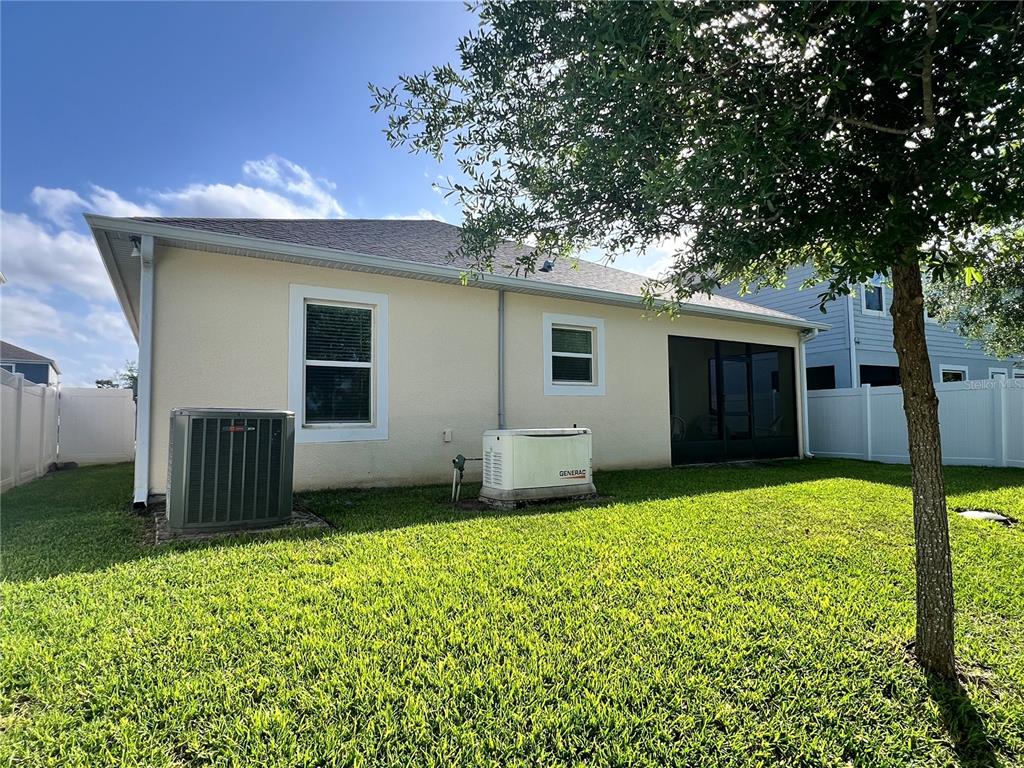 301 Jackson Loop DeLand, FL 32724 - Photo 22 of 22 a view of a house with a yard and garage