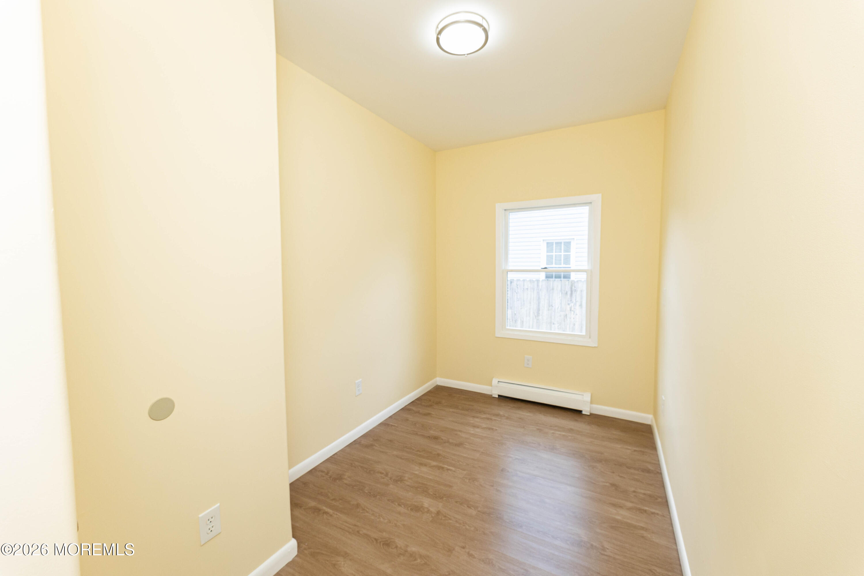 2408 Herbertsville Road Point Pleasant, NJ 08742 - Photo 59 of 82 a view of a small space with wooden floor and a window