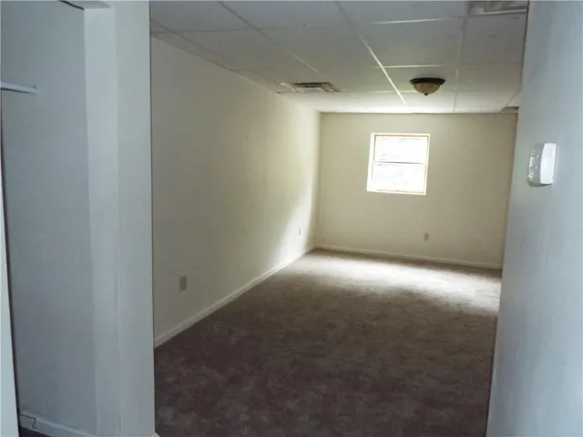 a kitchen with a stove top oven a sink and a refrigerator