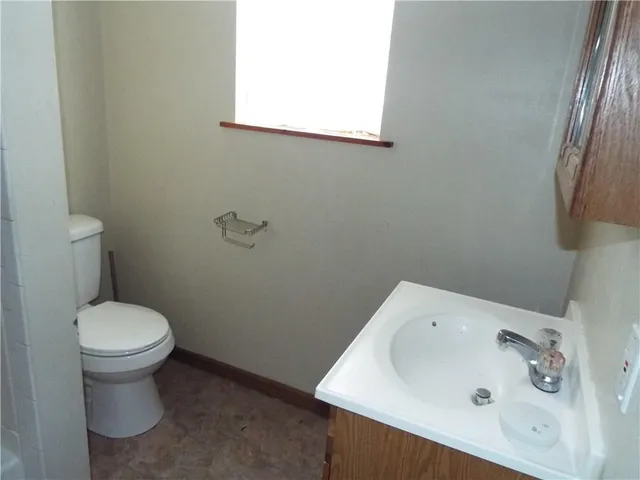 a view of a chandelier fan and a table