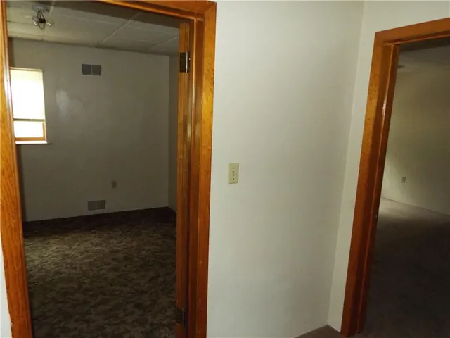 a view of hallway with a large window