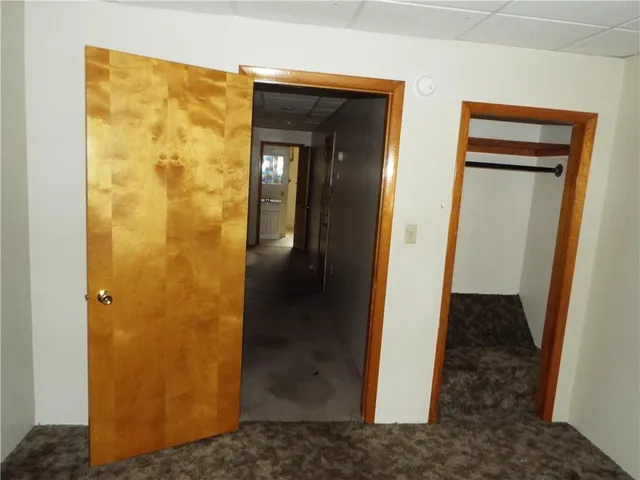 a kitchen with white cabinets appliances and a sink