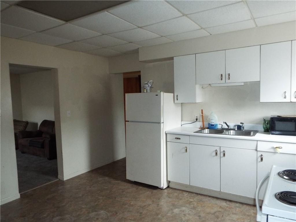 559 Schoonmaker Avenue Monessen, PA 15062 - Photo 40 of 50 a kitchen with cabinets and refrigerator