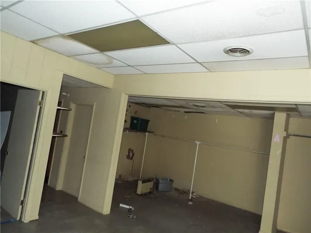 a living room with a balcony furniture and a large window