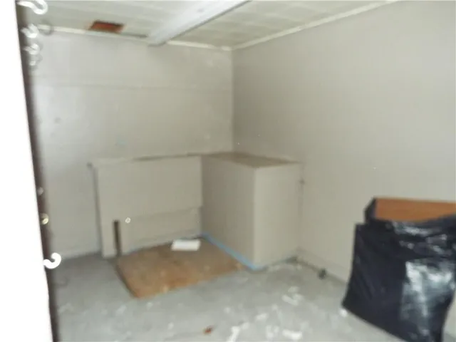 a bathroom with a shower and a sink