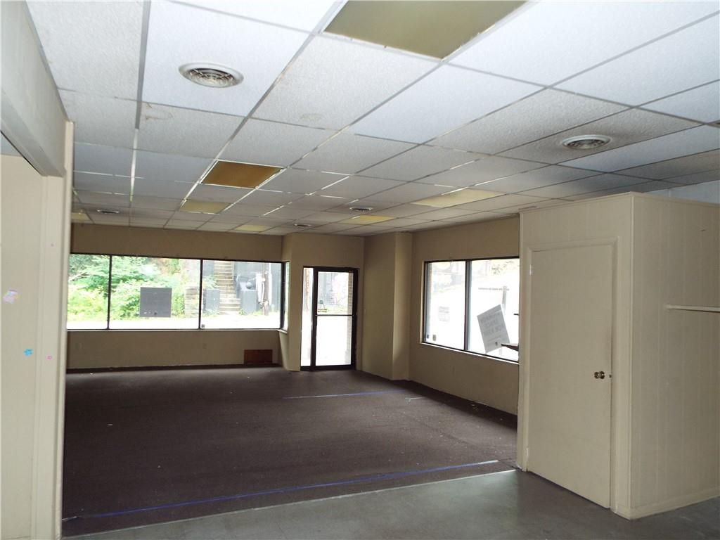 559 Schoonmaker Avenue Monessen, PA 15062 - Photo 48 of 50 a living room with a balcony furniture and a large window