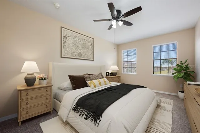 a bedroom with a bed and a potted plant